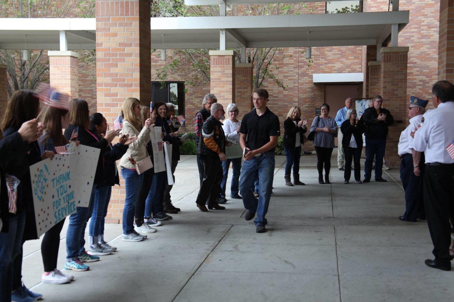 At the end of each TEAM event, participants form two lines for recruits to walk through for a pep-rally style sendoff.